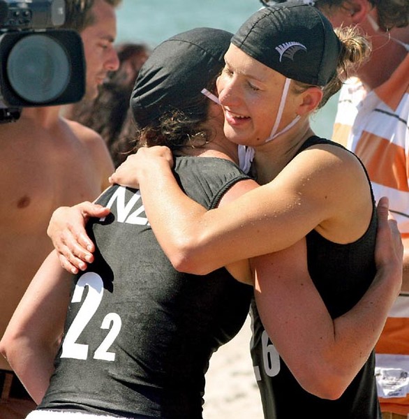 New Zealand's Nikki Cox is congratulated by teammate Chelsea Maples (right) after the pair finished first and third in the board race at the world lifesaving championships in Germany.